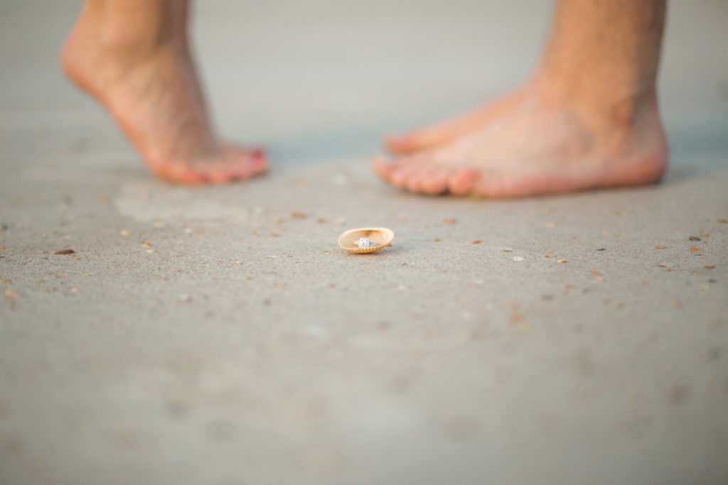 Melbourne beach photographer photographs engaged couple on the beach at Smyrna dunes park 