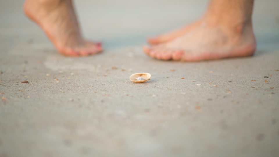 Melbourne beach photographer photographs engaged couple on the beach at Smyrna dunes park