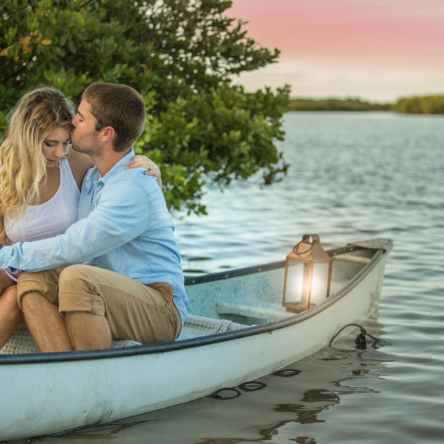 Engagement photos taken in a canoe in the river at New Smyrna Beach, FL