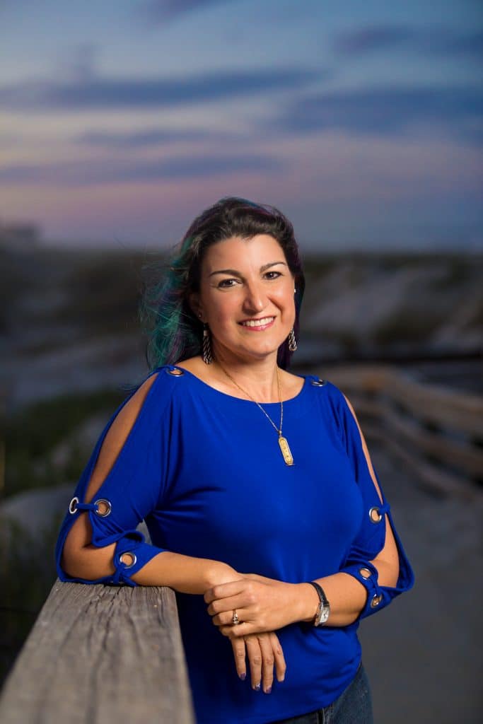 A real estate agent poses for a professional photoshoot with a new smyrna beach photographer, daytona beach headshots