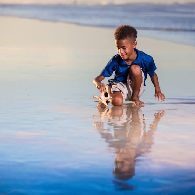 Ormond beach family portrait session on the beach at their vacation rental