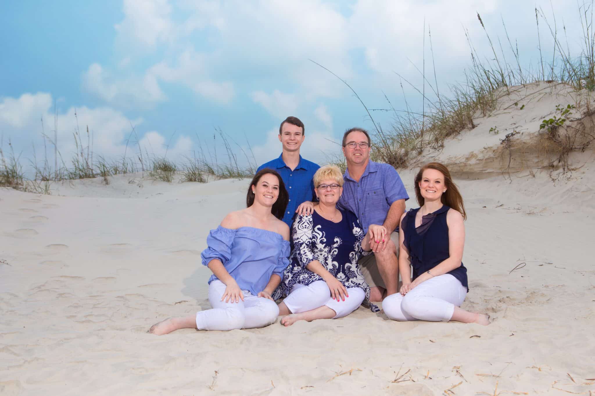 Ponce Inlet Family portrait by the dunes by Ponce Inlet photographer that specializes in Ponce Inlet photography