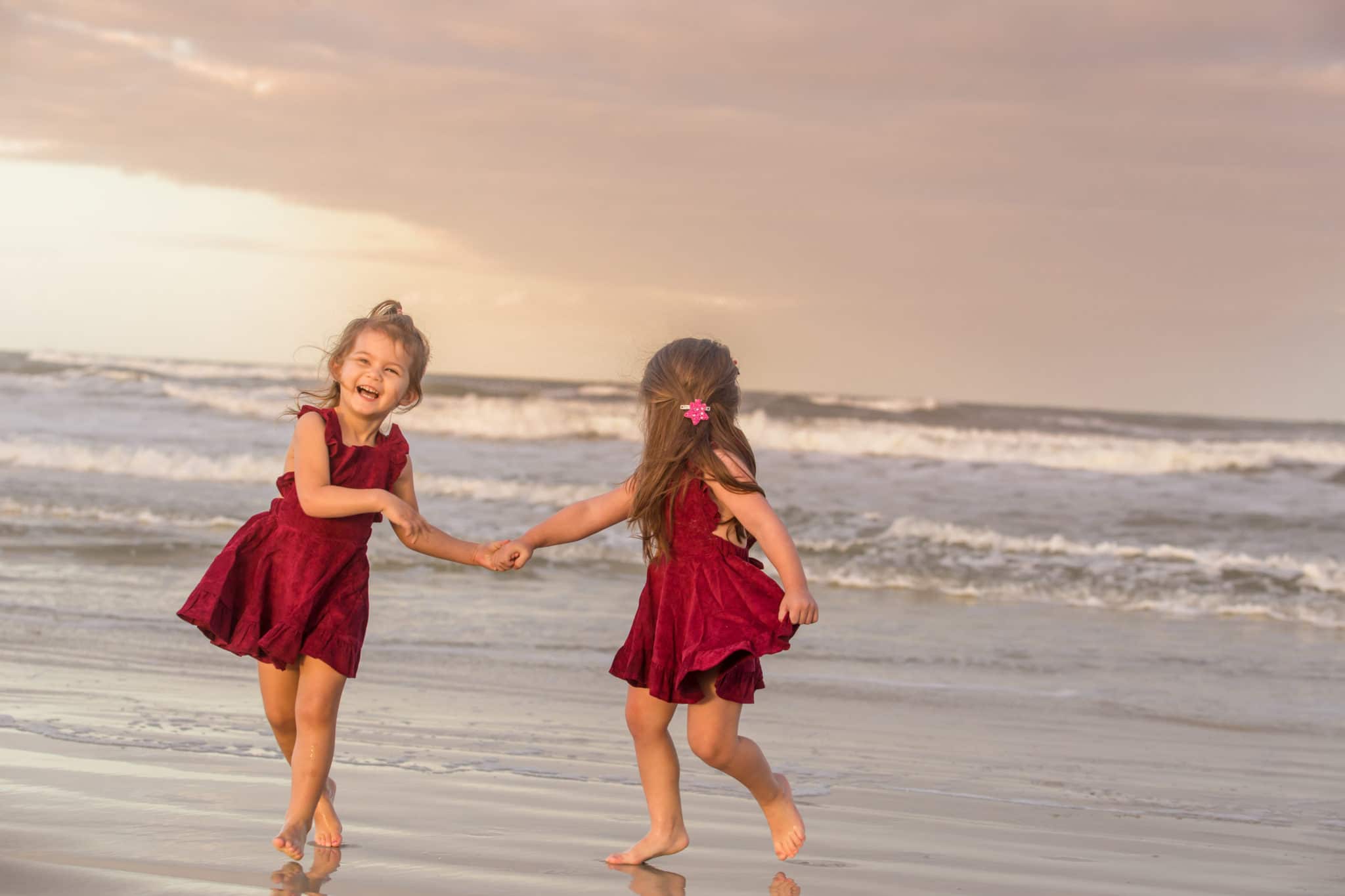 Children running on the beach during a New Smyrna Beach Family photography session at sunset by a New Smyrna Beach Photographer