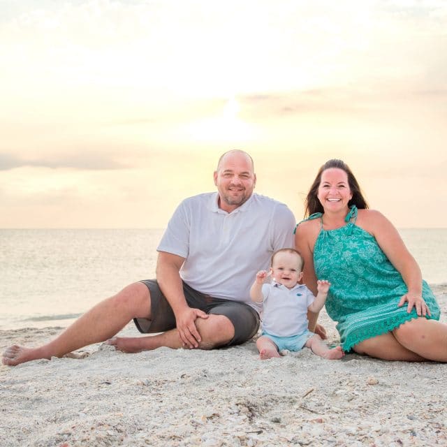 family photo at sunset on the beachin lido key fl