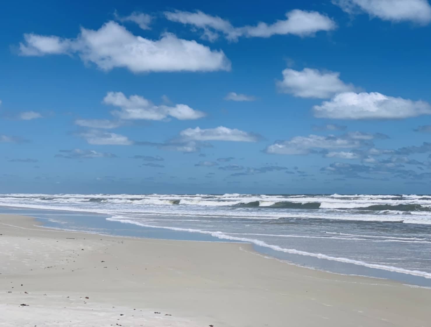 Ponce Inlet beach photo on sunny blue sky day