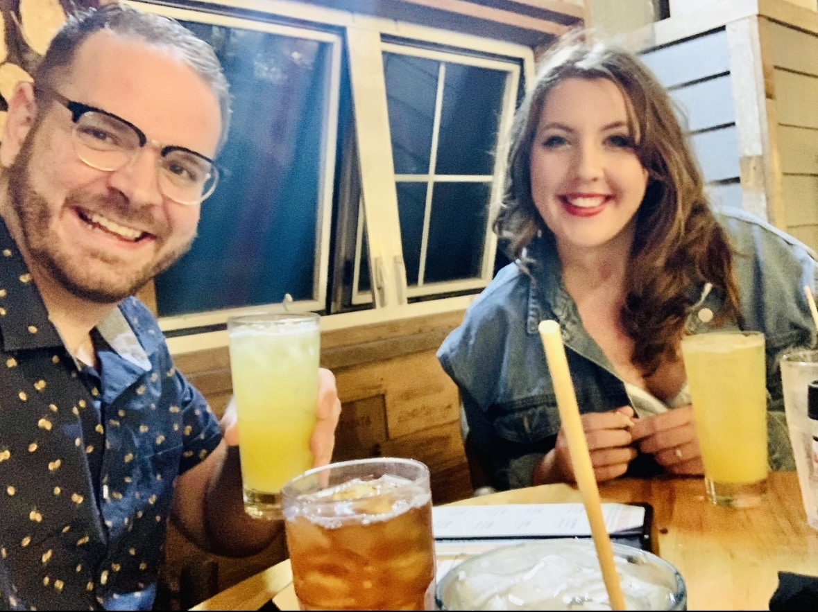 Jon and Heather enjoying dinner and drinks in New Smyrna Beach at Norwoods treehouse bar. Norwoods is one of the best restaurants in New Smyrna Beach with outdoor seating