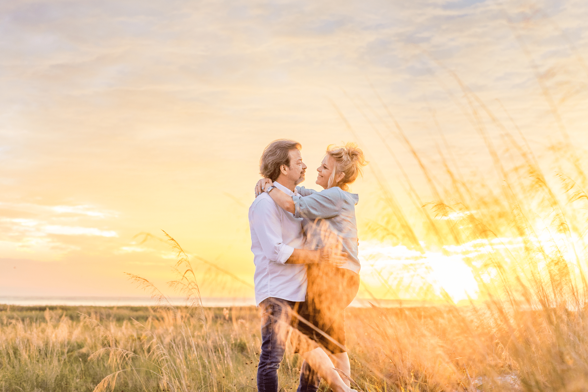 siesta key photographer captures couple celebrating anniversary with a beach photography session in siesta key at sunset