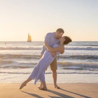 photo of a couple on the beach at sunset by a clearwater Photographer