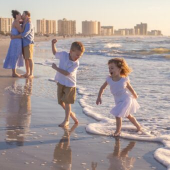 clearwater photographer captures image of a family of 4 on the beach at sand key park