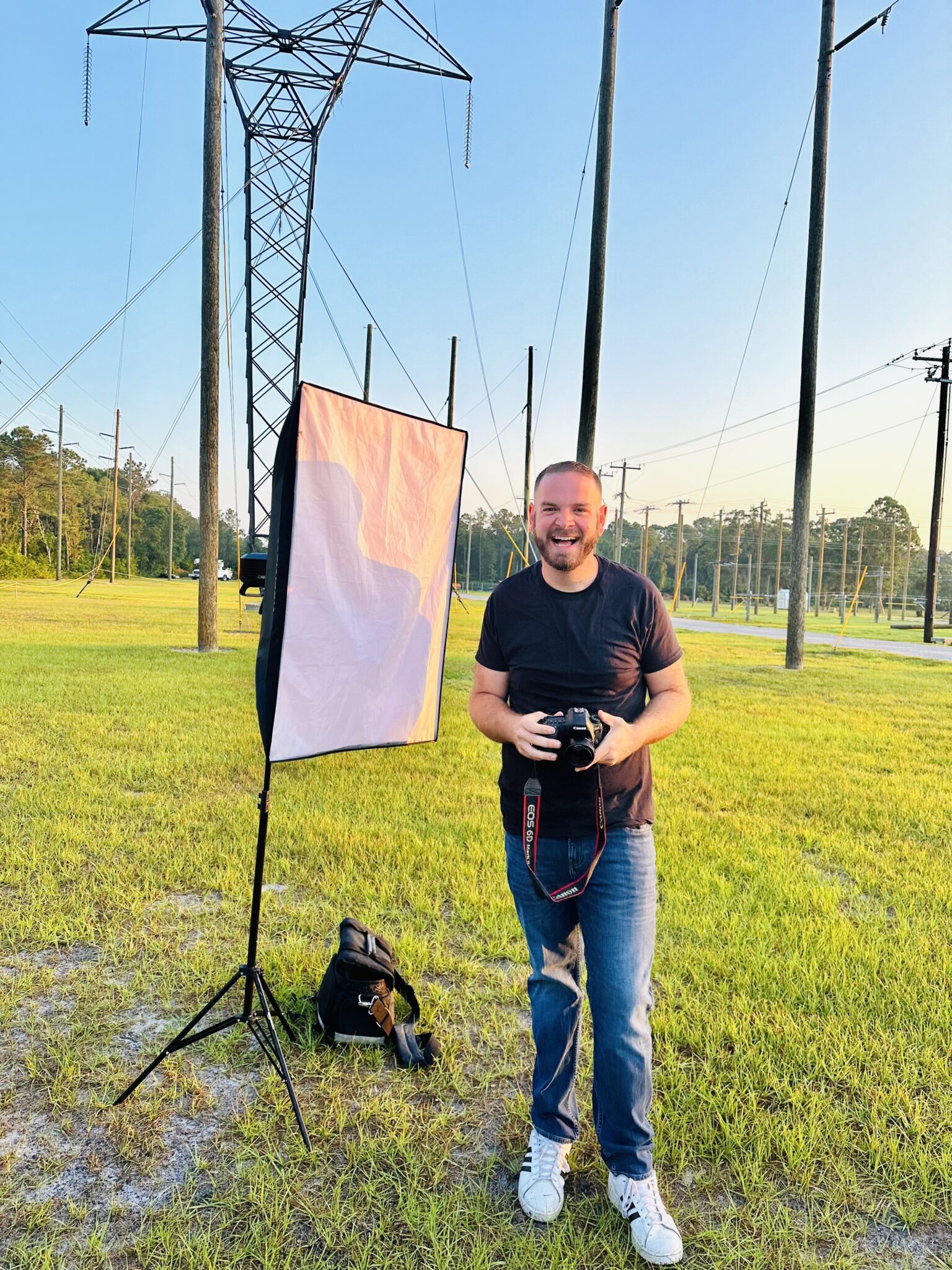 Photographer Jon Hinson working on location with camera and lights